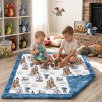 Children playing on personalized dragon castle blanket with blue trim