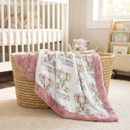 Personalized elephant baby blanket with pink minky trim draped over wicker basket