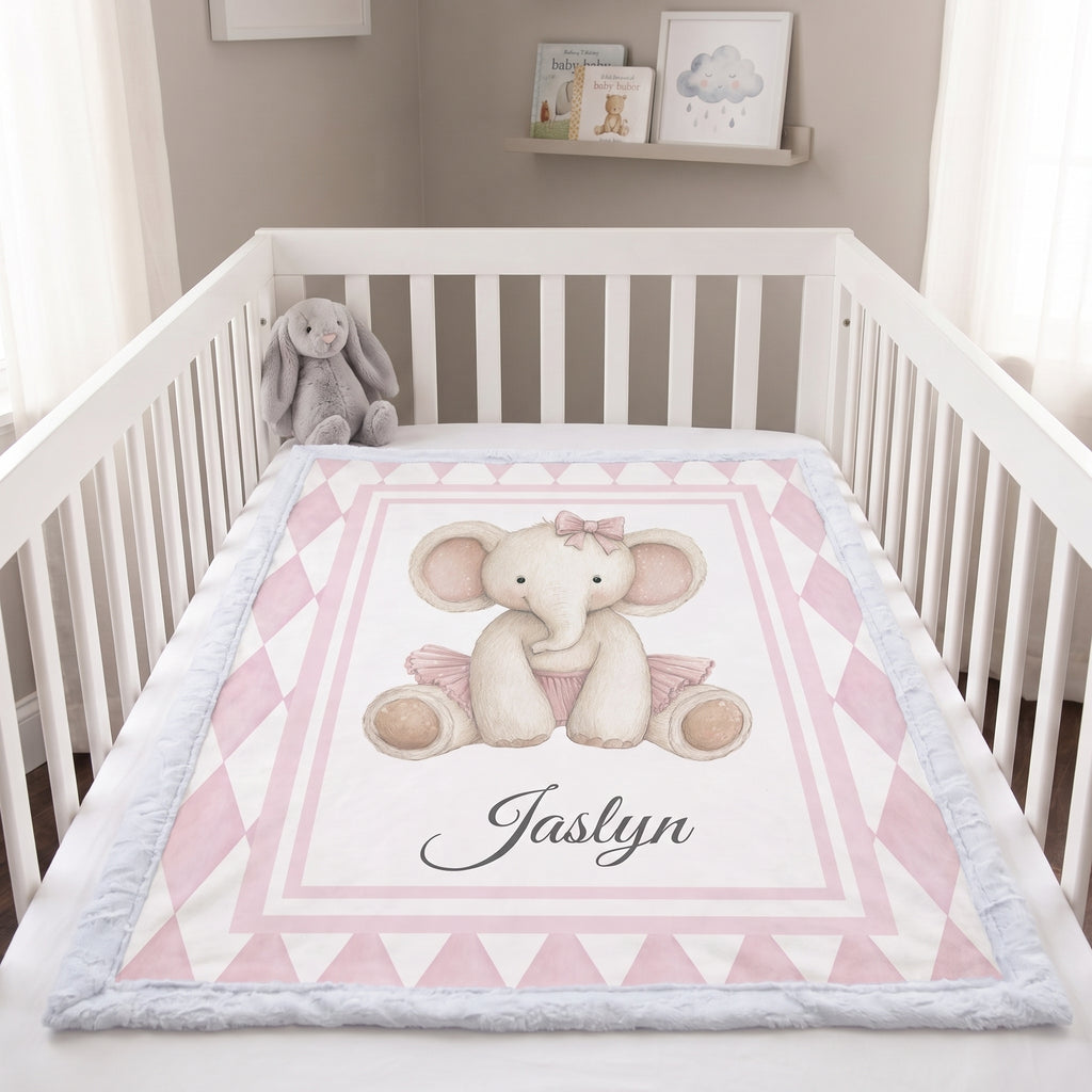Personalized elephant minky blanket laid flat in crib with plush bunny