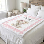 Personalized elephant minky blanket laid flat on bed in farmhouse-style bedroom
