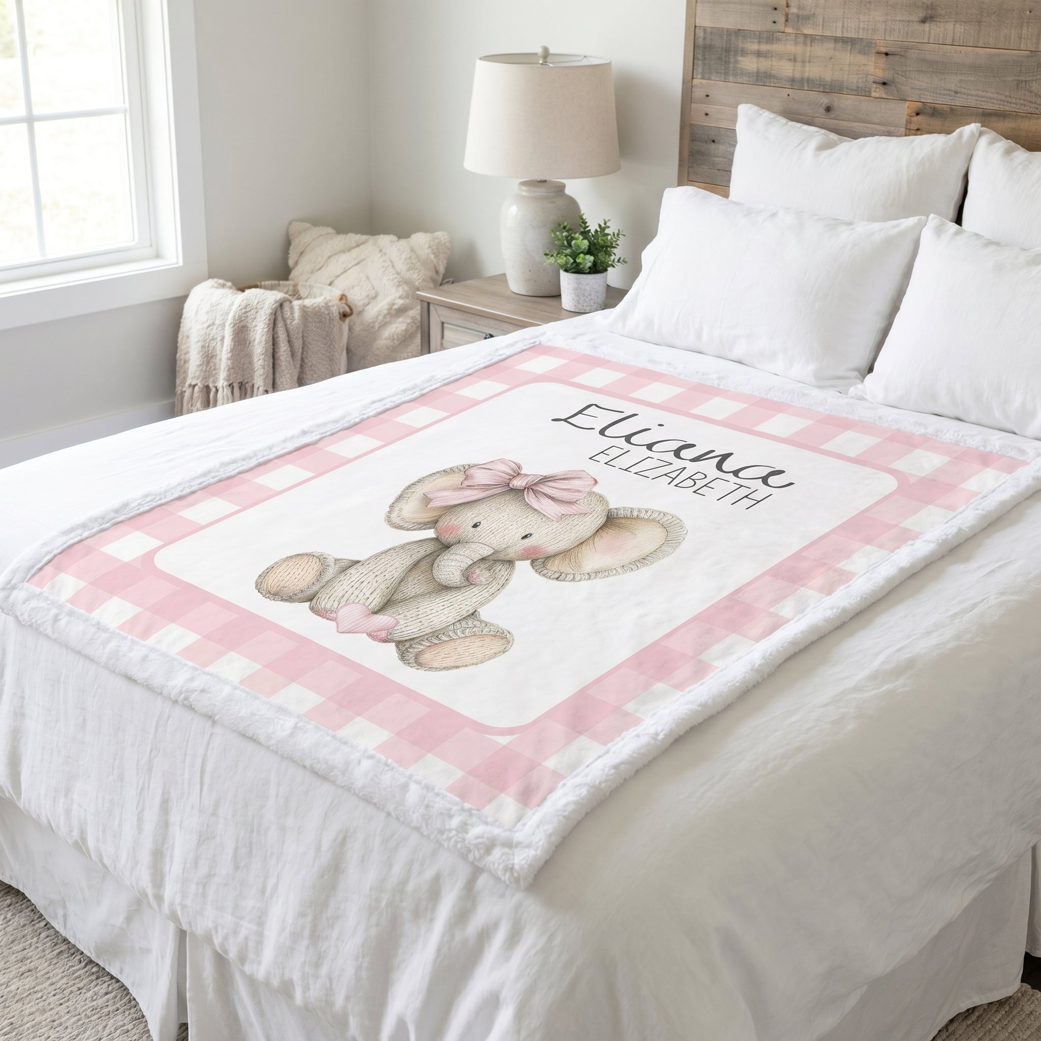 Personalized elephant minky blanket laid flat on bed in farmhouse-style bedroom