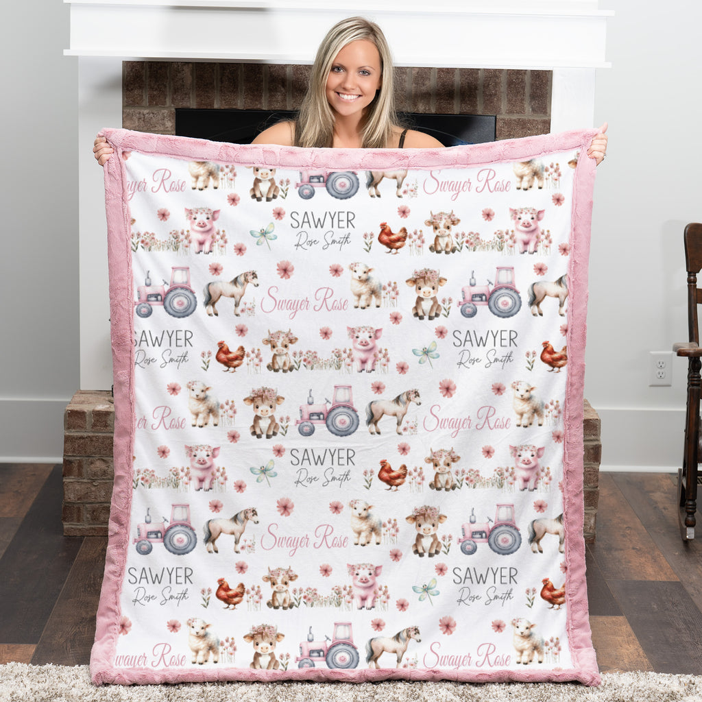 Personalized farm animal minky baby blanket laid flat showing full pattern and embroidered name