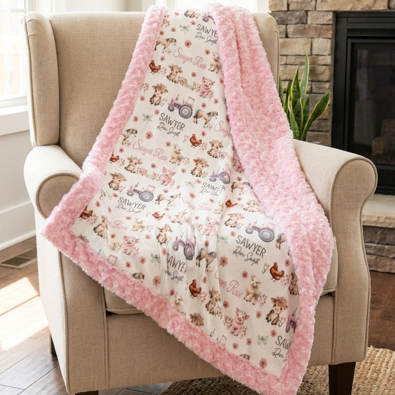 Two children playing on personalized farm animal minky baby blanket with toys
