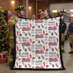 Personalized firefighter baby blanket with black faux fur border, held by firefighters at fire station