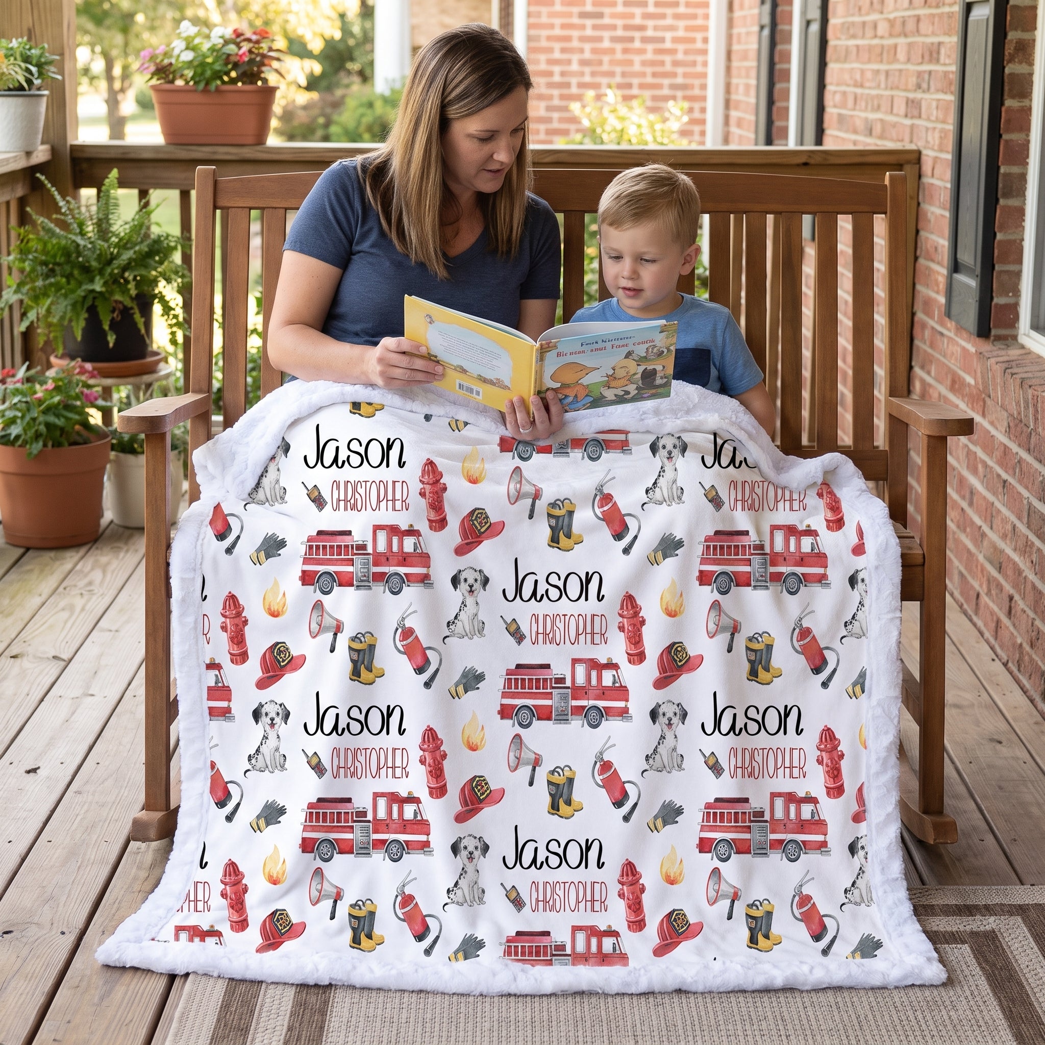 Personalized firefighter baby blanket with custom name, woman and boy reading on porch bench
