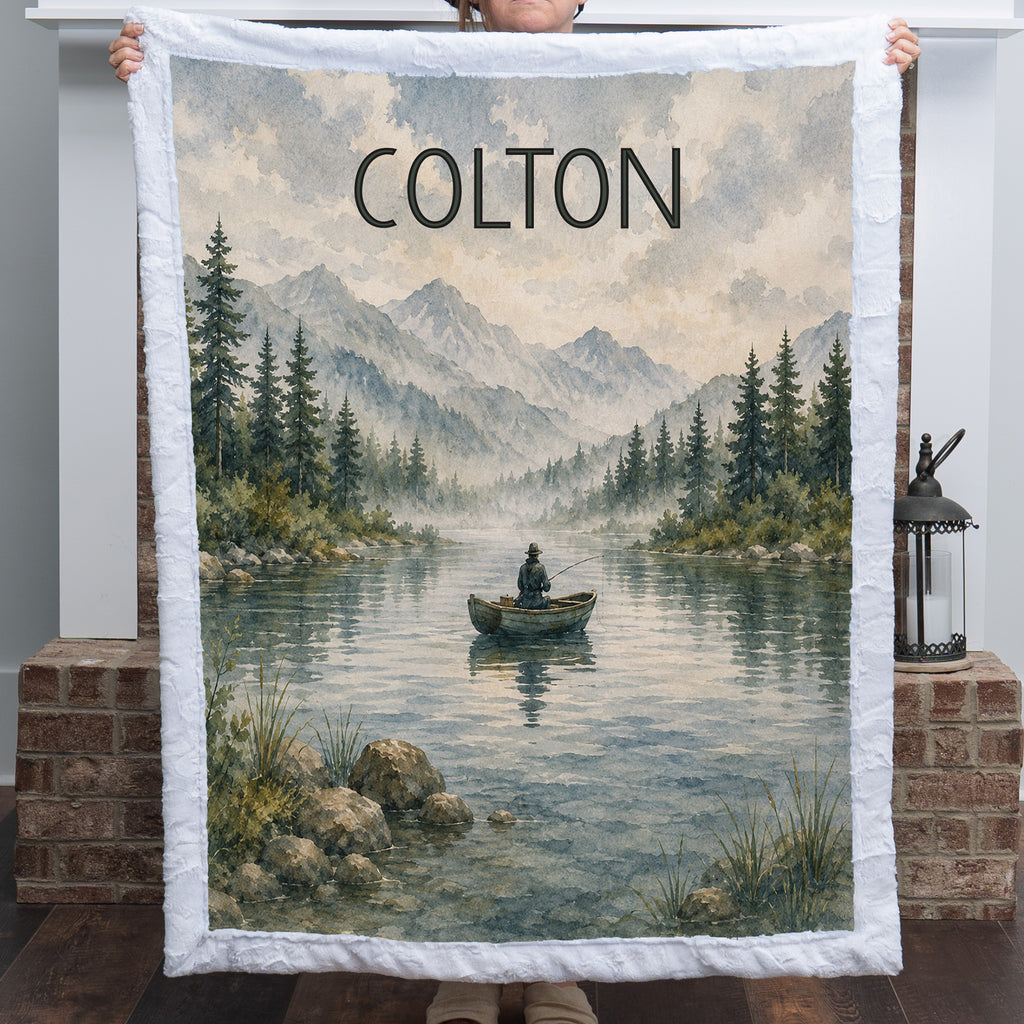 Personalized fishing lake blanket in Luxe Cuddle Minky, held up by a fireplace mantel