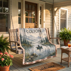 Personalized fishing lake blanket draped over a porch swing with potted flowers