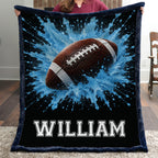 Personalized football minky baby blanket with navy trim and name William, held indoors