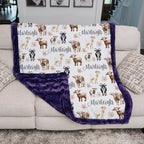 Personalized goat and floral minky blanket draped on couch showing purple minky backing