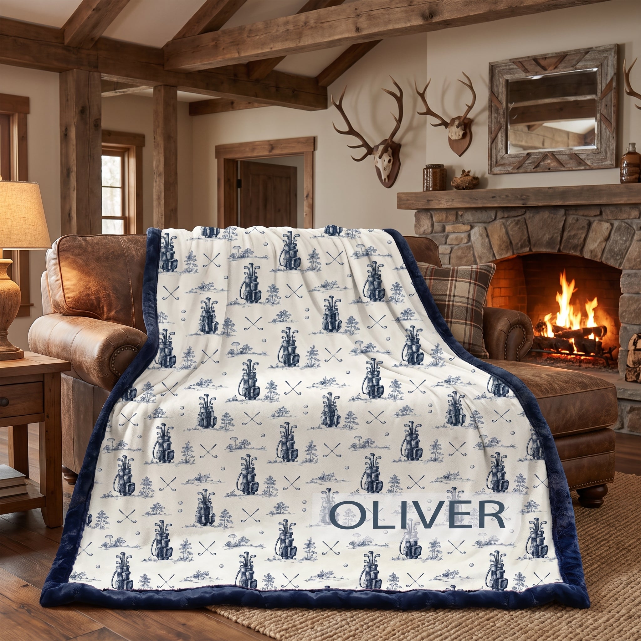 Personalized golf-print minky blanket with name Oliver draped over leather chair in cabin living room