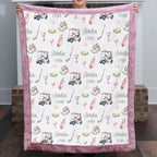 Woman holding personalized golf minky blanket with pink trim indoors