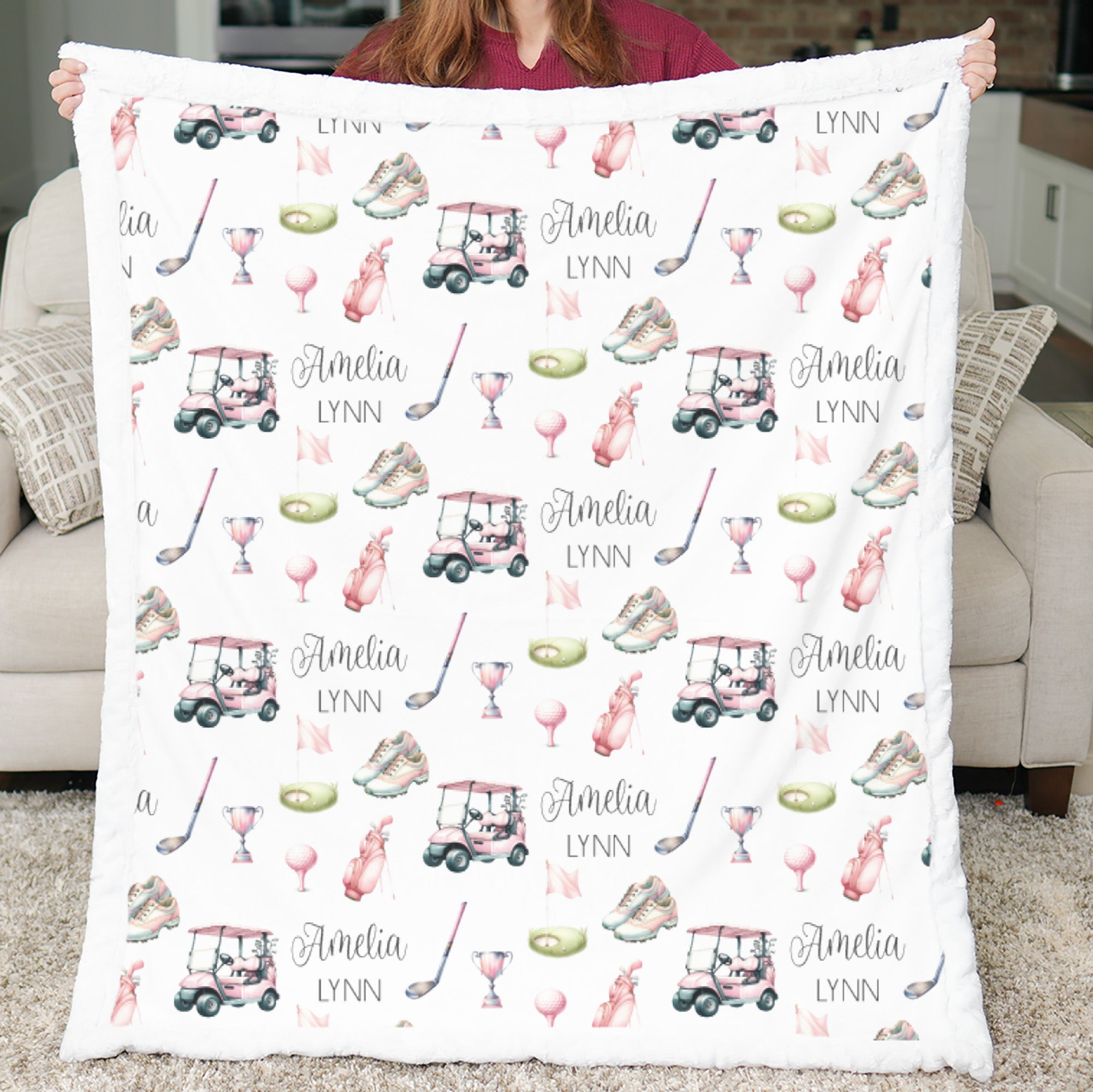 Woman holding personalized golf minky blanket with white sherpa back