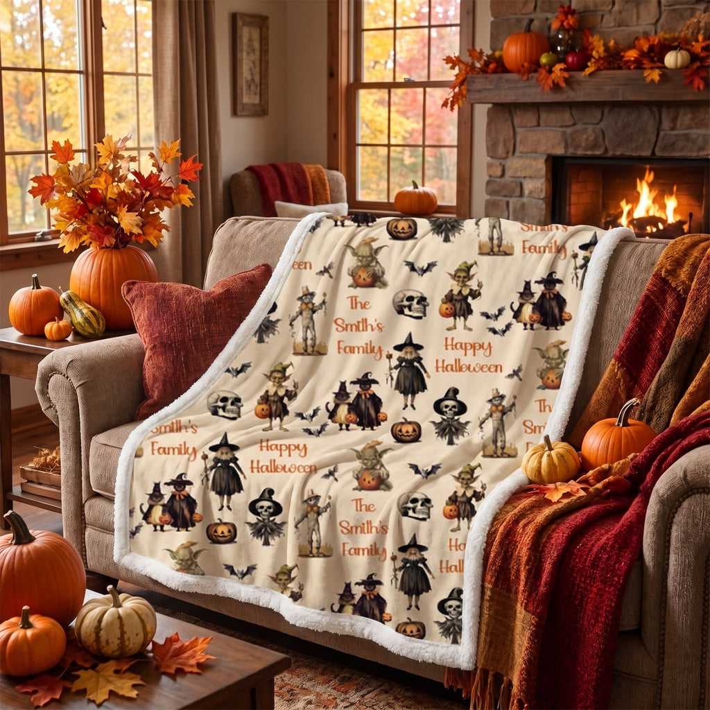 Personalized Halloween throw blanket on armchair beside fireplace with pumpkins and autumn decor