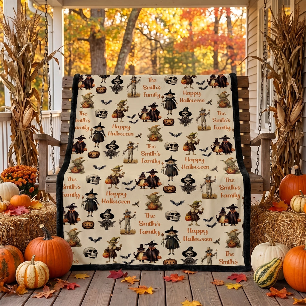 Personalized Halloween throw blanket draped over porch swing with cornstalks and pumpkins