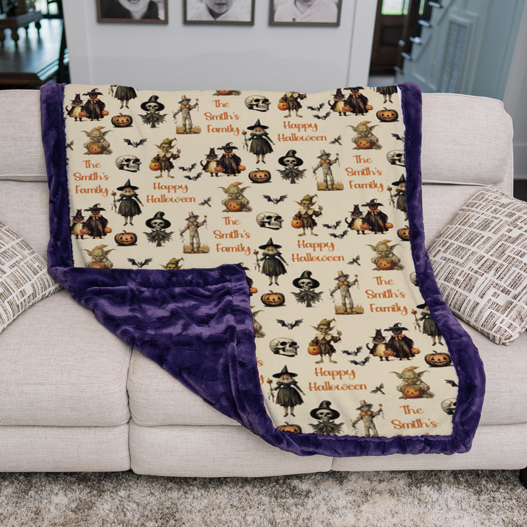 Personalized Halloween throw blanket draped over couch corner showing purple sherpa backing