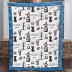 Boy holding personalized Halloween minky blanket with witch, cat, and ghost design, blue trim