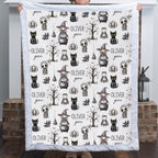 Woman holding personalized Halloween minky blanket with white faux fur trim over fireplace mantel