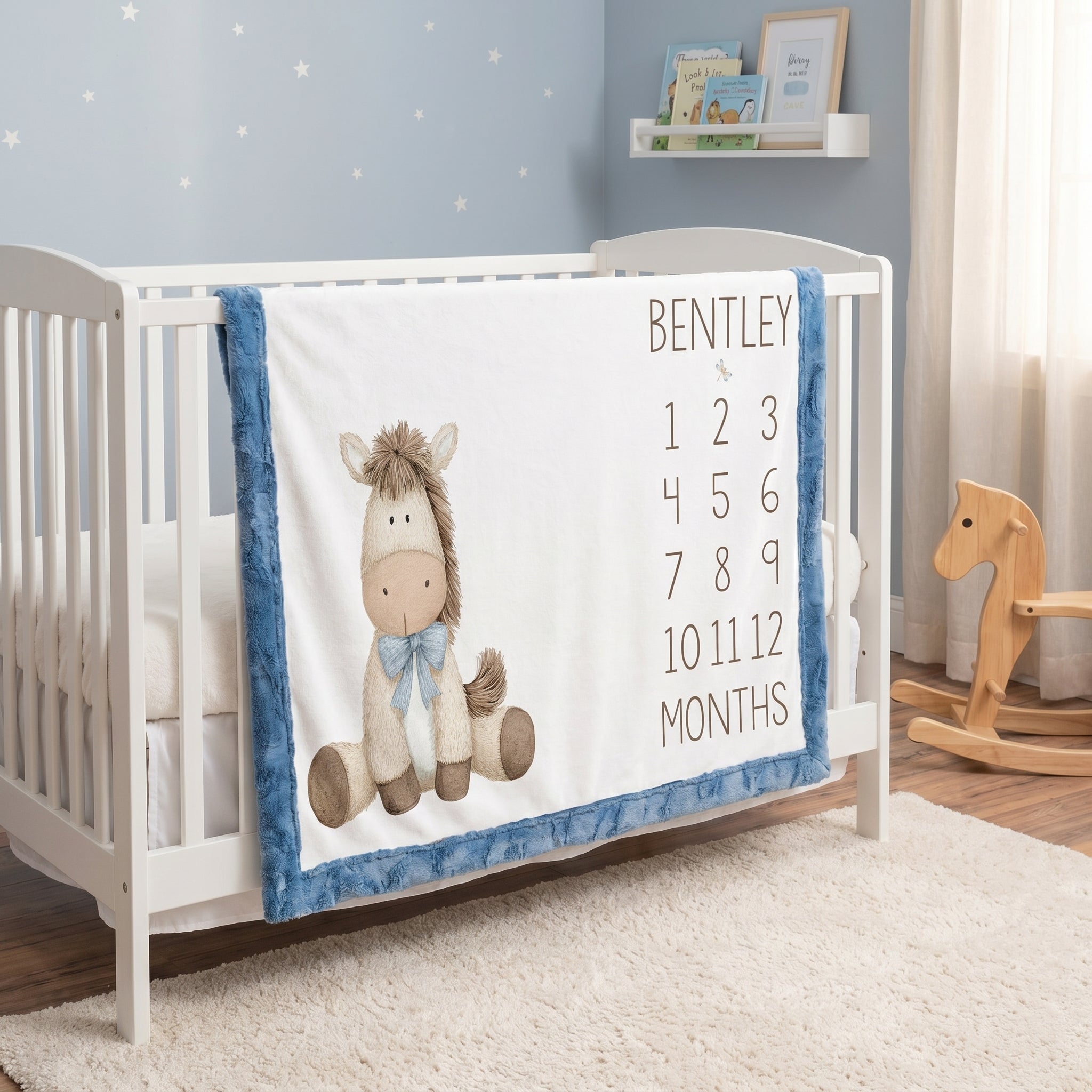 Personalized horse milestone baby blanket with custom name draped over white crib