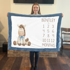 Woman holding personalized horse milestone blanket with custom name, blue faux fur trim