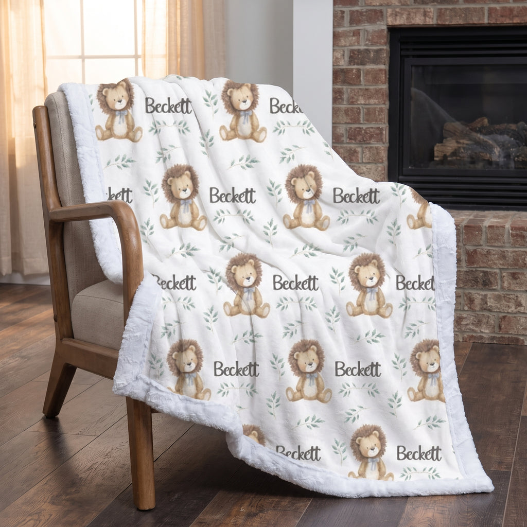 Personalized minky lion baby blanket draped over wooden armchair by brick fireplace