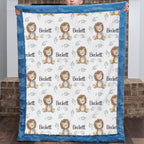 Child holding personalized minky lion baby blanket with blue fur border by brick fireplace