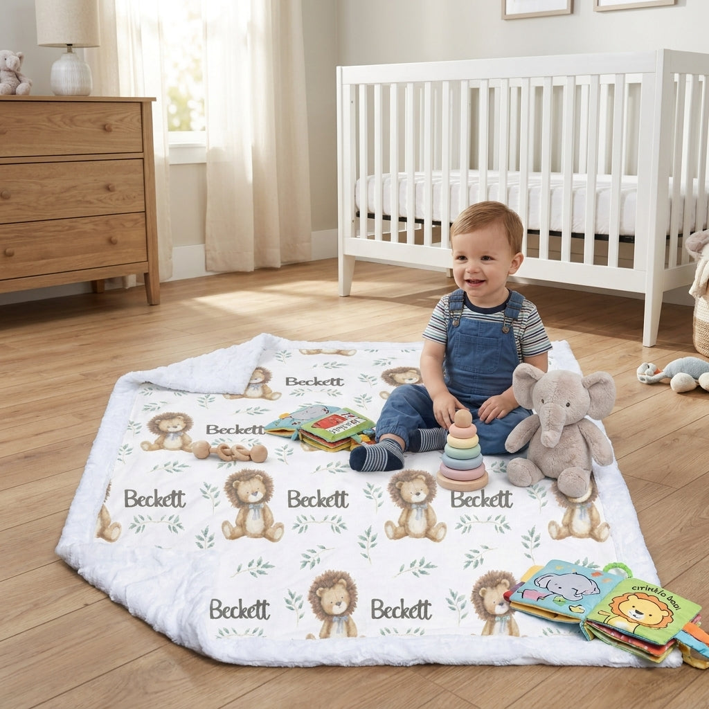 Toddler sitting on personalized minky lion baby blanket in nursery playroom with toys