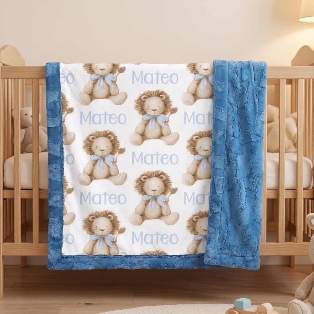 Personalized lion print minky baby blanket draped over a wooden crib rail in nursery