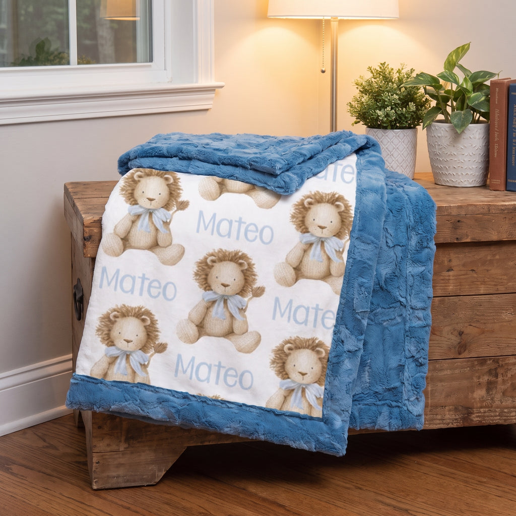 Personalized lion print minky baby blanket folded over a wooden trunk in living room