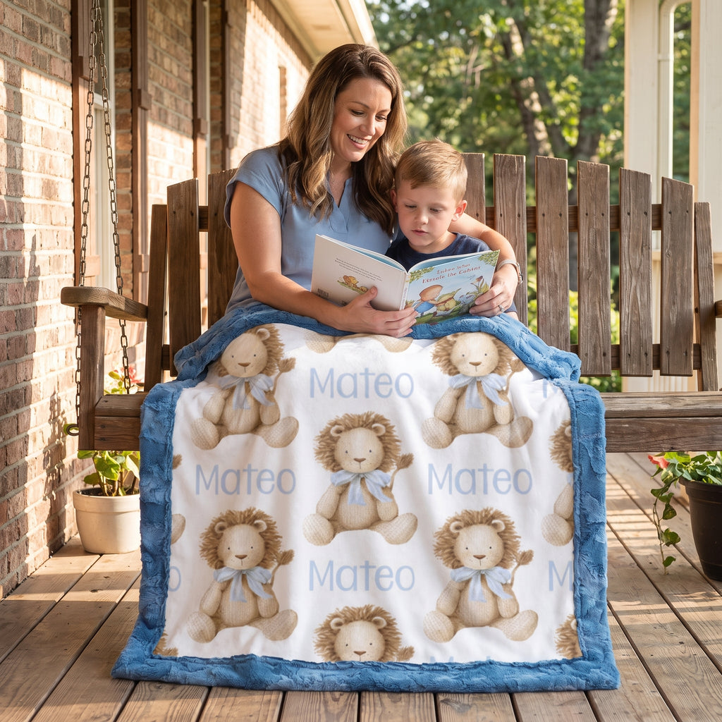 Mom reading to boy while personalized lion print minky blanket covers their laps on porch swing