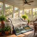 Personalized mountain lake blanket with a Dad keepsake message draped over a porch bench among ferns