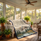 Personalized mountain lake blanket with a Dad keepsake message draped over a porch bench among ferns