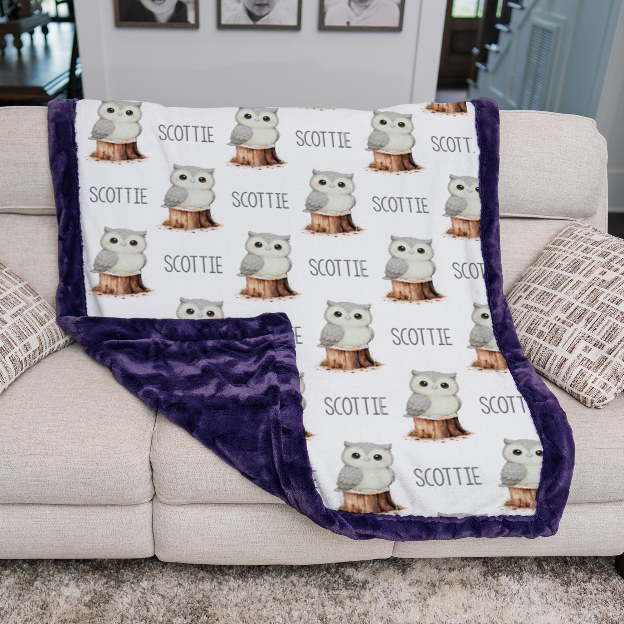 Woman holding personalized owl minky blanket with purple trim