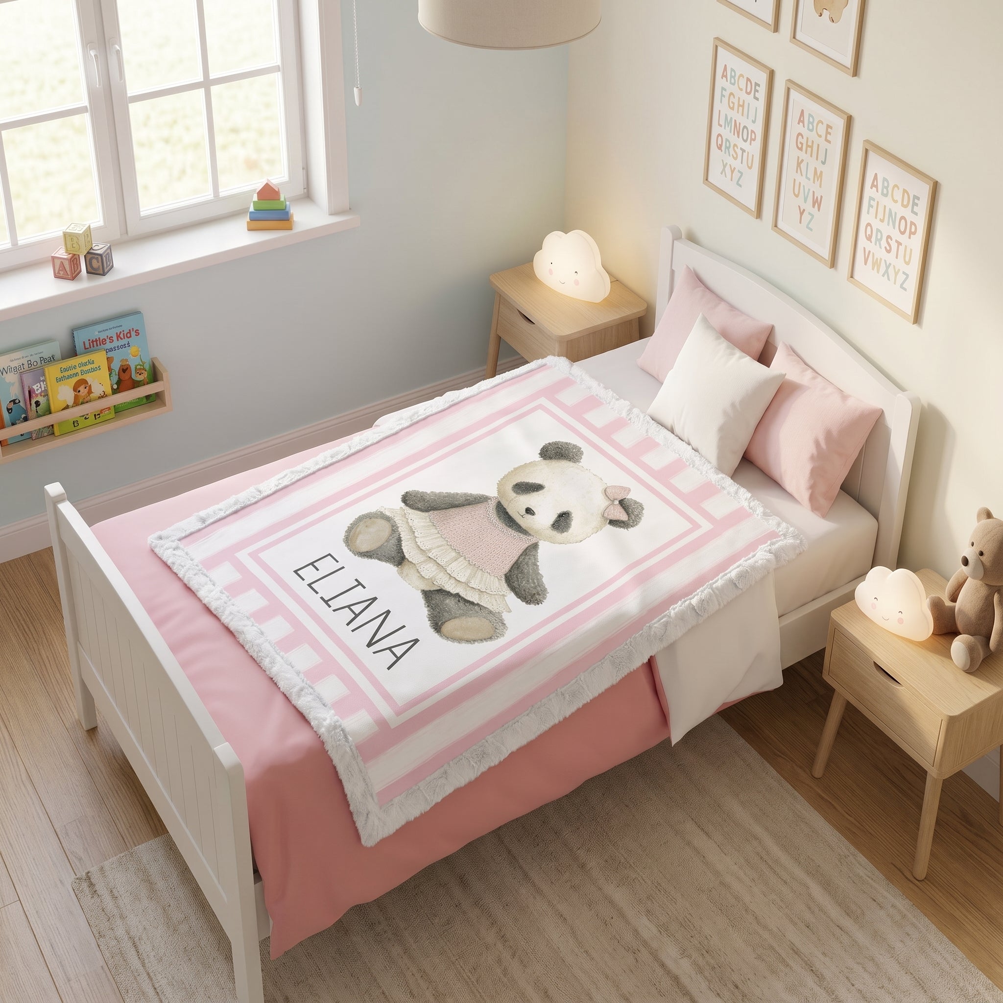 Personalized minky panda baby blanket with pink stripe border on toddler bed