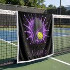 Personalized purple pickleball blanket with name Nicole draped over a courtside chair