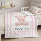 Personalized Luxe Cuddle Minky pig baby blanket with pink stripe border on toddler bed