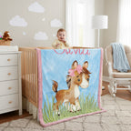 Personalized pony minky baby blanket with custom name hanging on white nursery crib with baby