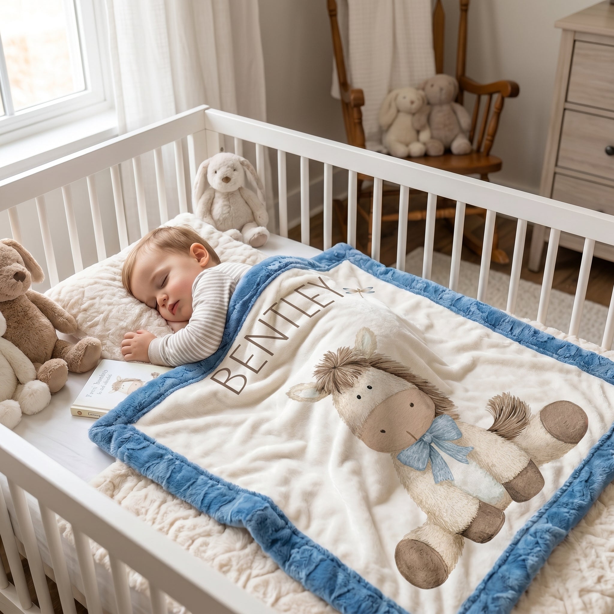 Toddler sleeping with personalized pony baby blanket, blue minky trim, in nursery crib