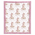 Close-up of personalized pony name blanket pattern with pink minky trim