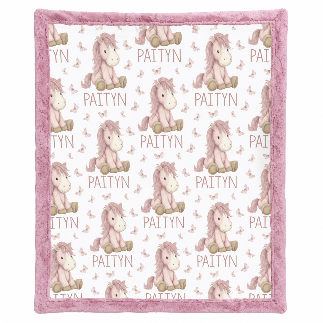 Close-up of personalized pony name blanket pattern with pink minky trim