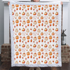 Woman holding personalized pumpkin patch minky blanket with custom name, white faux fur trim