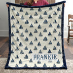 Woman holding personalized sailboat minky blanket with FRANKIE name indoors