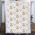 Woman holding personalized teddy bear minky baby blanket with white rosette minky border