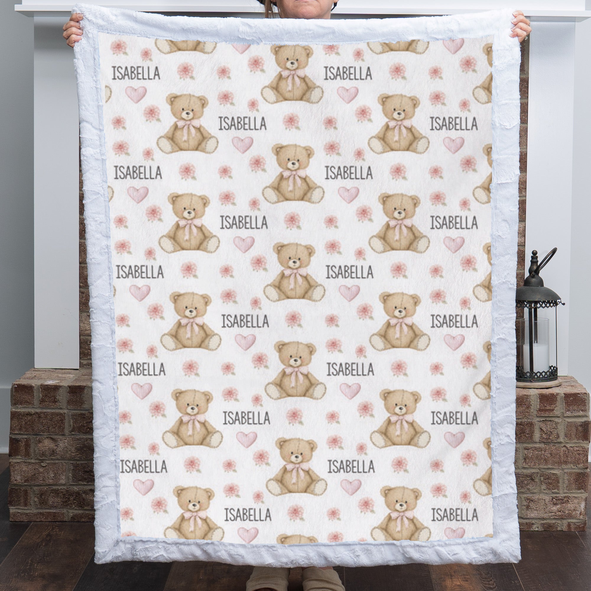 Woman holding personalized teddy bear minky baby blanket with white rosette minky border