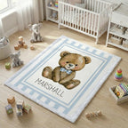Personalized minky teddy bear baby blanket flat-lay on nursery floor surrounded by toys