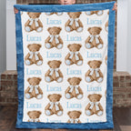 Personalized minky baby blanket with teddy bear print held up by child, blue trim close-up