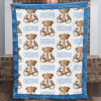 Personalized teddy bear minky baby blanket held up by a child, name printed throughout the pattern
