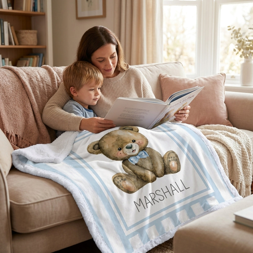 Mother and child reading together with personalized minky teddy bear baby blanket on couch