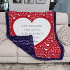 Red blanket with heart design and text on a couch