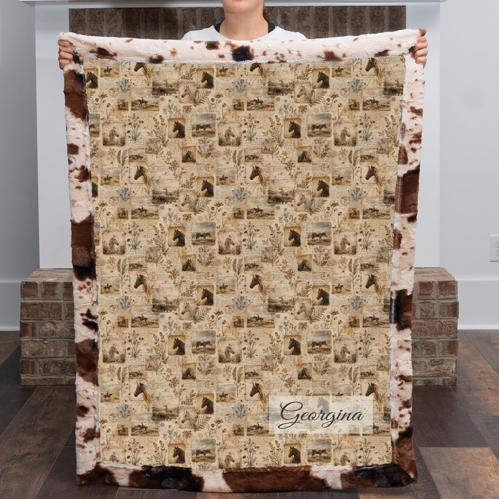 Woman holding personalized western horse blanket with custom name, cow print faux fur trim
