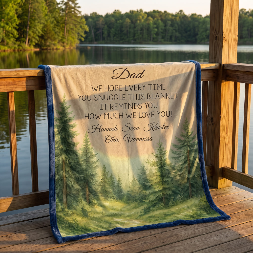 Personalized woodland minky throw for Dad on lakeside dock at sunset, blue border with pine forest scene